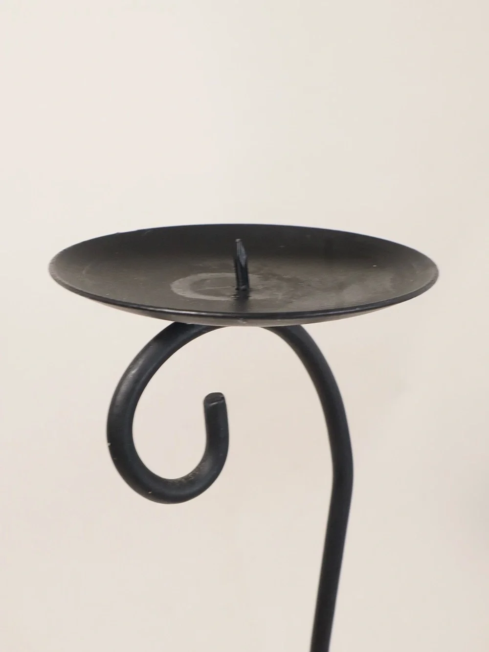 Vintage postmodern black metal double candle holder with a scrollwork design